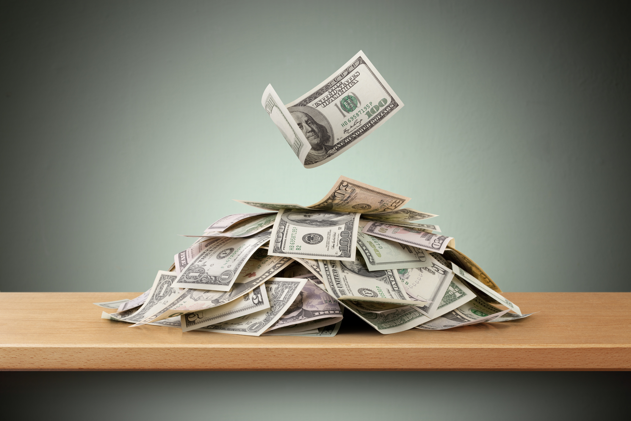 heap of paper currency on a table top