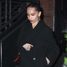 Zoe Kravitz wearing a black coat