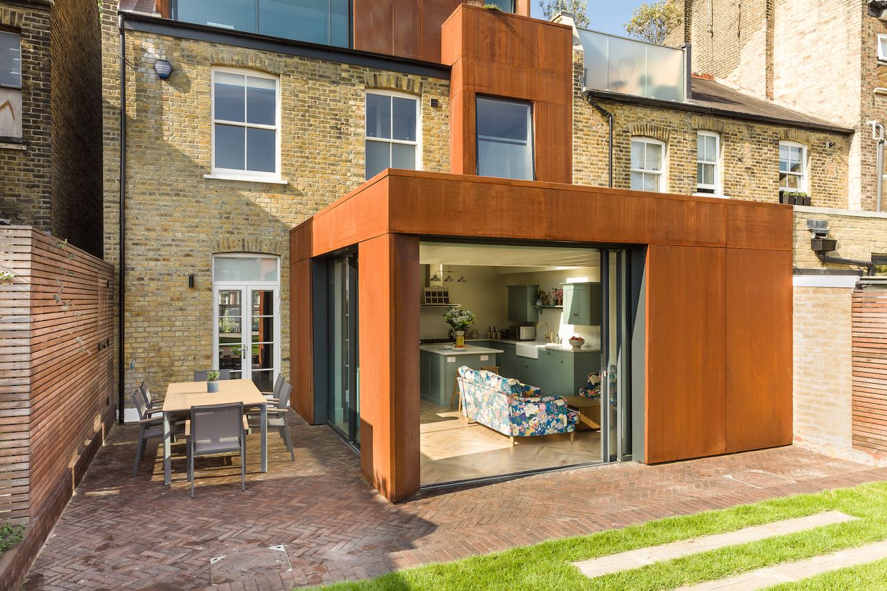 kitchen extension to terrace house clad in corten