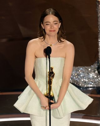 Emma Stone accepts the Lead Actress award for "Poor Things" onstage during the 96th Annual Academy Awards at Dolby Theatre on March 10, 2024 in Hollywood, California.