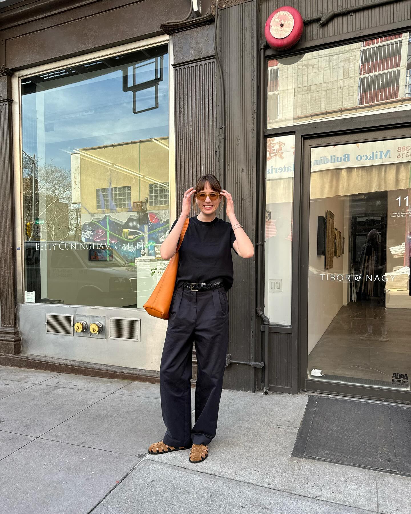 Influencer wears suede fisherman sandals.