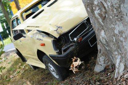 Yellow Car Crashed Into A Tree