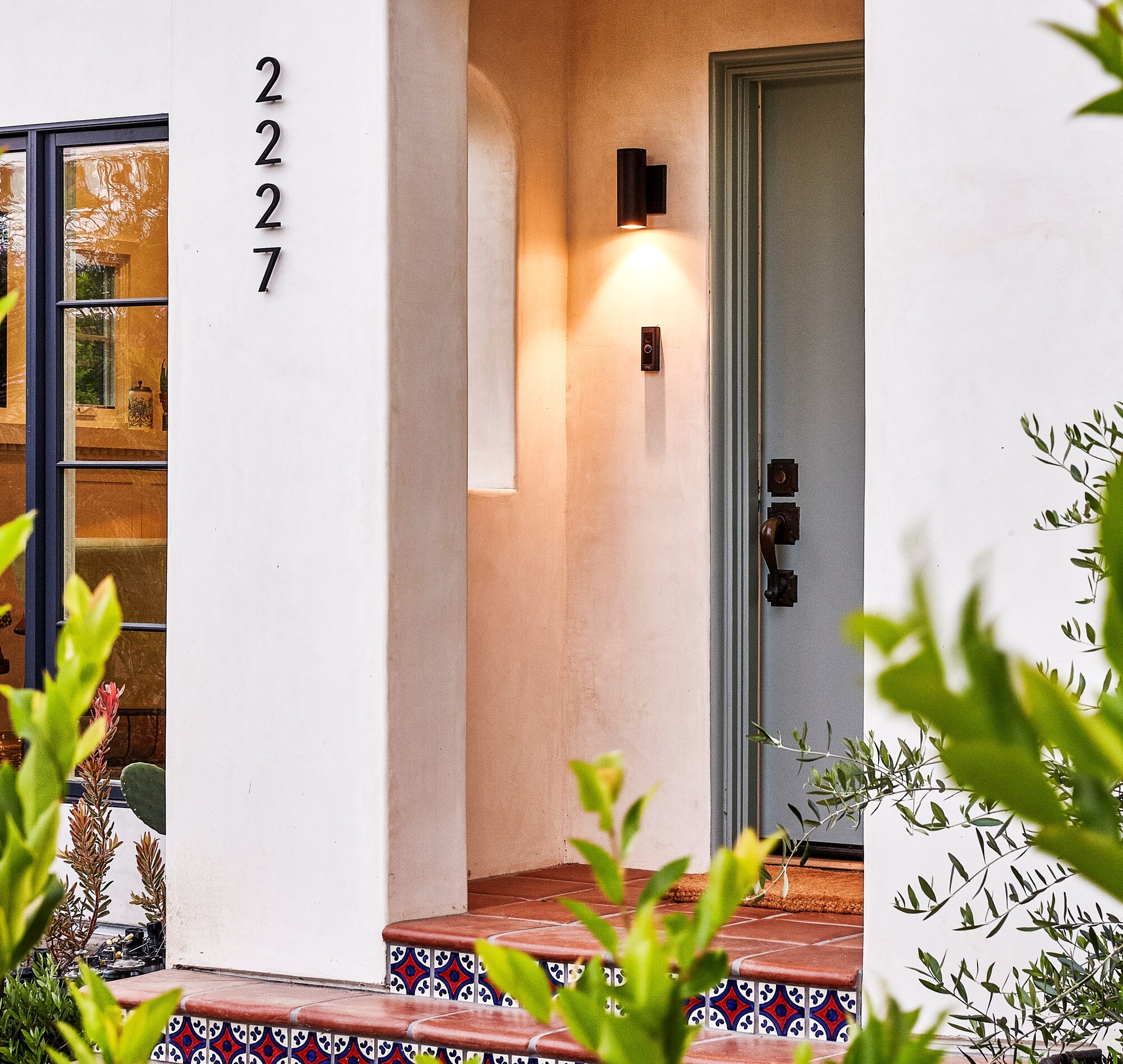A front porch with lighting