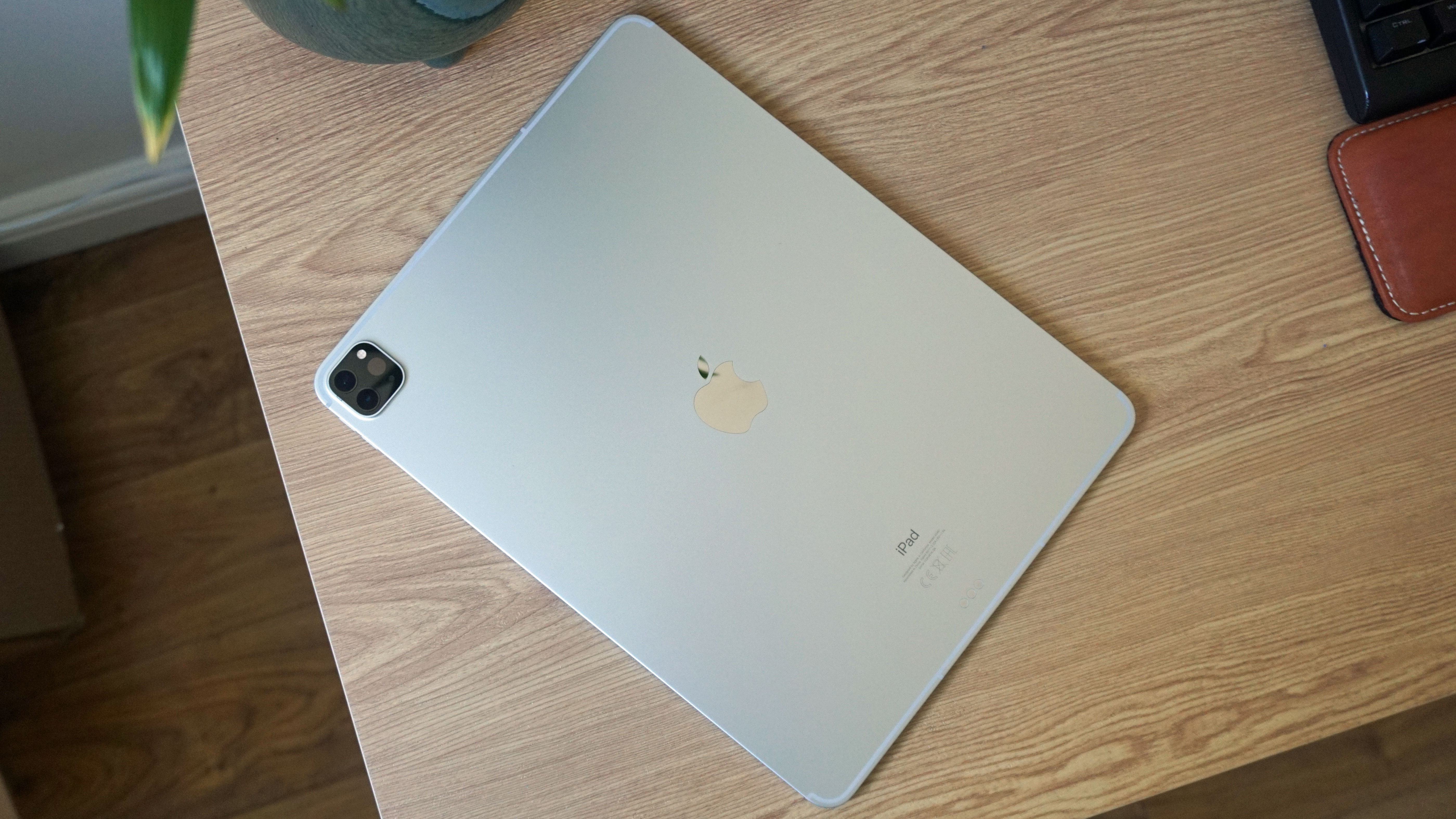 An iPad Pro 12.9 (2021) face down on a table