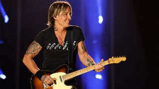 Keith Urban performs on stage during day two of CMA Fest 2023 at Nissan Stadium on June 09, 2023 in Nashville, Tennessee.