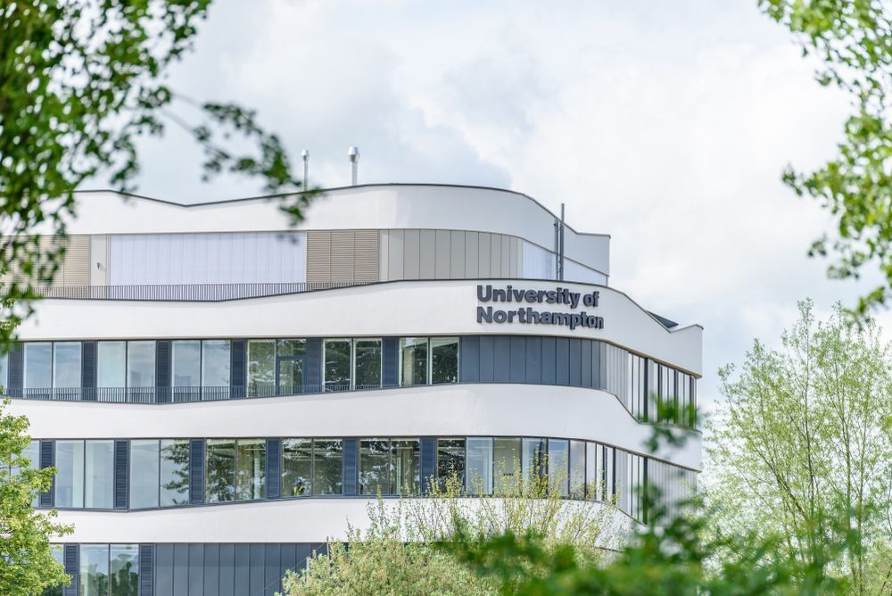 University of Northampton logo sign on new building on nene river