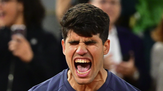 Carlos Alcaraz of Spain celebrates winning match point against Stefanos Tsitsipas of Greece in the Men's Singles Quarter Final match during Day Ten of the 2024 French Open at Roland Garros ahead of the Alcaraz vs Sinner