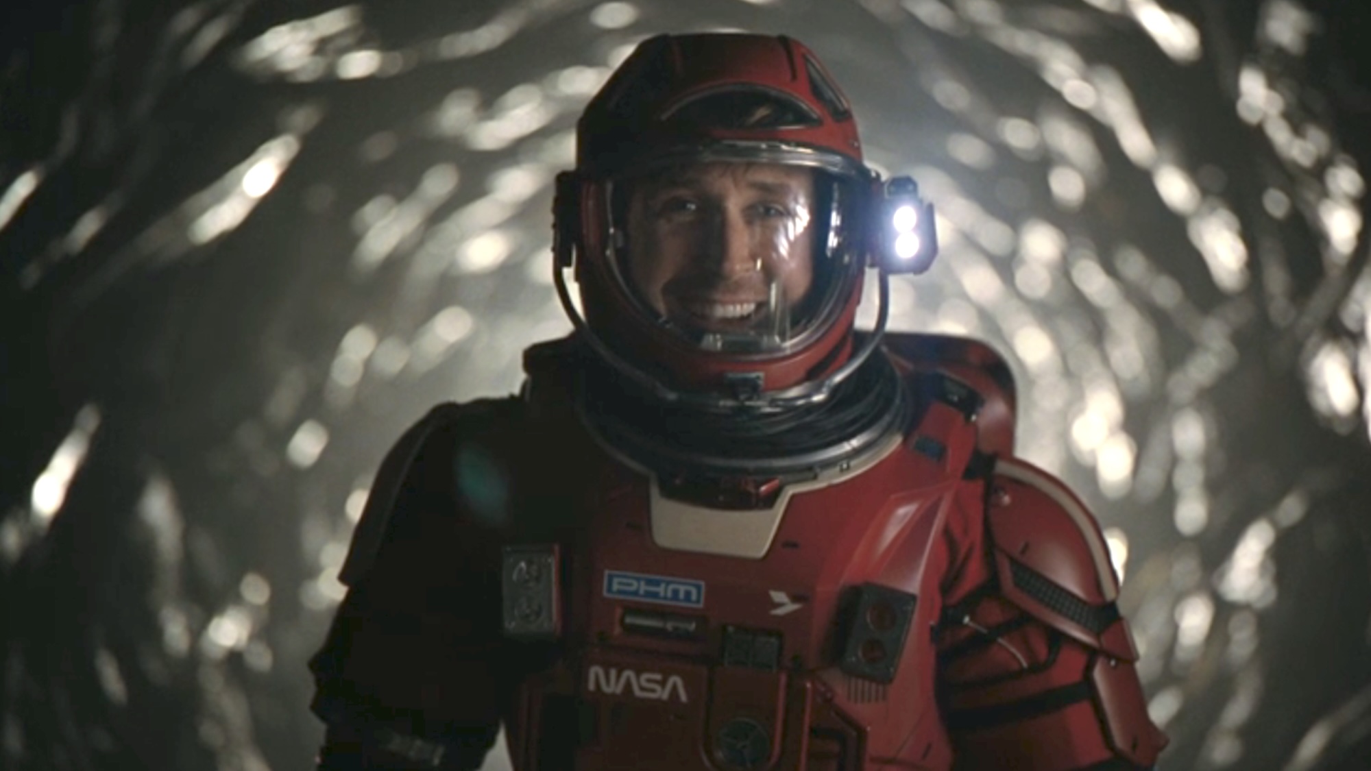 Grace laughing in his space suit in Project Hail Mary
