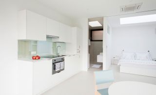 Bright white kitchen inside guest house