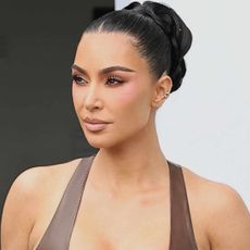 Kim Kardashian was spotted after a L.A. photoshoot in a leather and suede skirt set, plus the leather trench coat trend