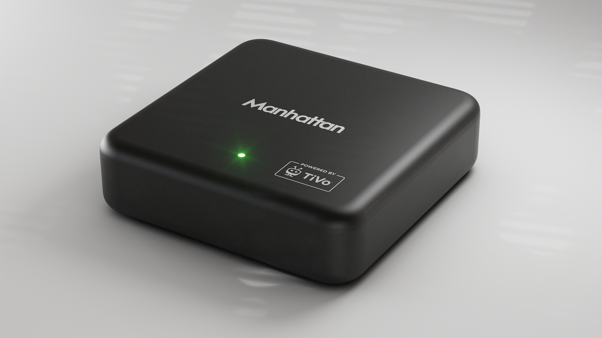 Manhatten TV Aero 4K TV Streamer with Freely &amp;ndash; box in lifestyle shot