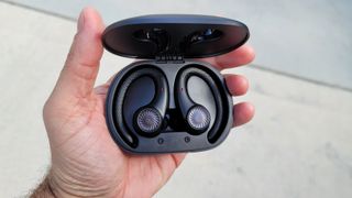 The Tribit MoveBuds H1 wireless earbuds displayed in their charging case