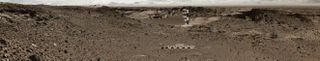 On Jan. 28, 2014, Curiosity Mars Rover used its Mast Camera to take the images combined in this scene. The sand dune in the upper center of the image spans a gap, called "Dingo Gap," between two short scarps. The dune is about 3 feet (1 meter) high. The nearer edge of it is about 115 feet (35 meters) away from the rover.