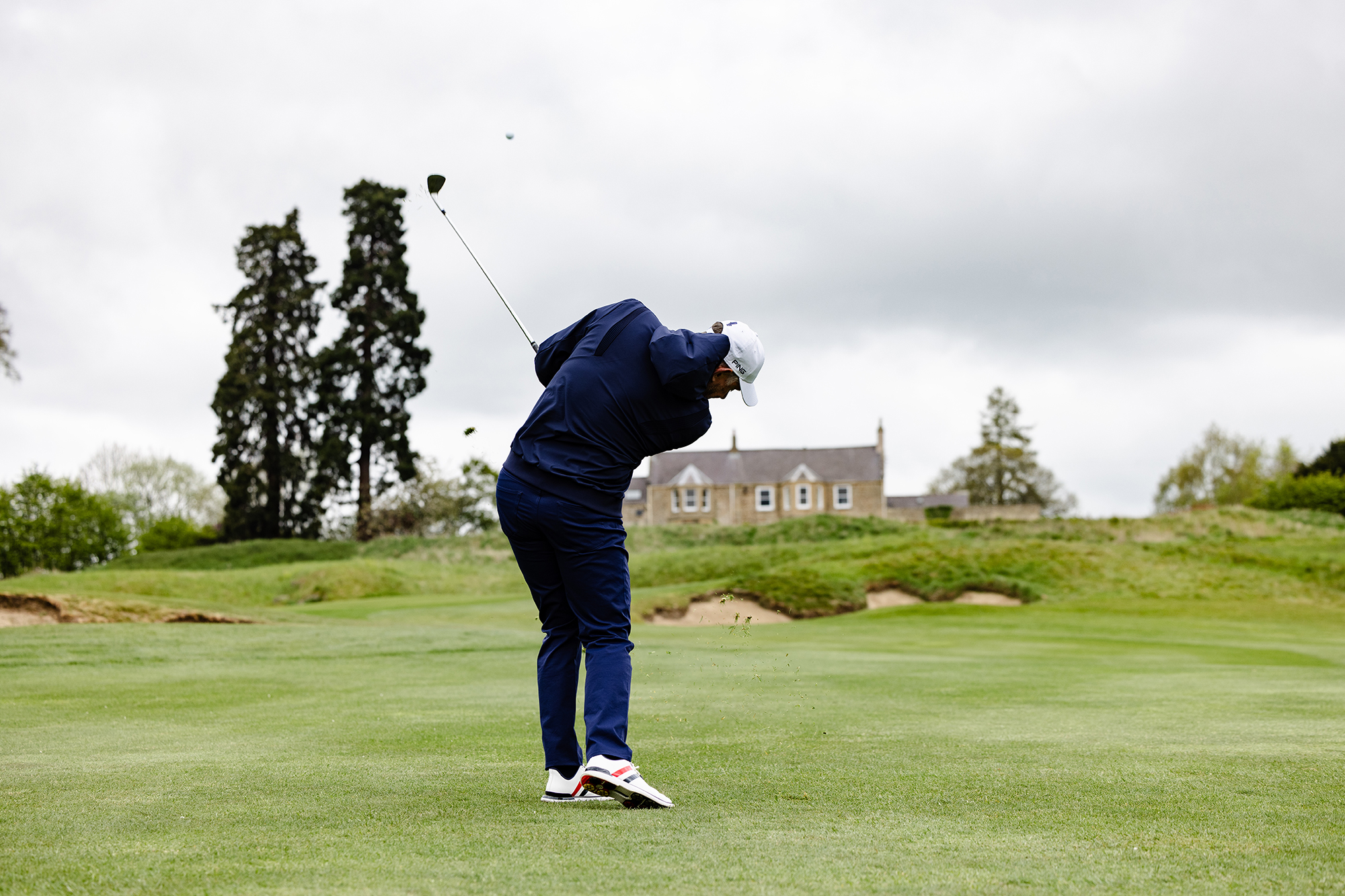 Lee Westwood hitting a wedge shot on approach to the green at Close House
