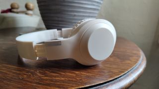 Temu headphones on a wooden table