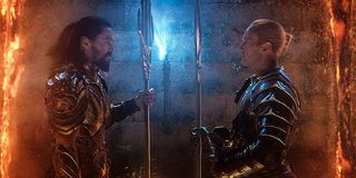 Arthur Curry and Orm facing off with weapons in Aquaman