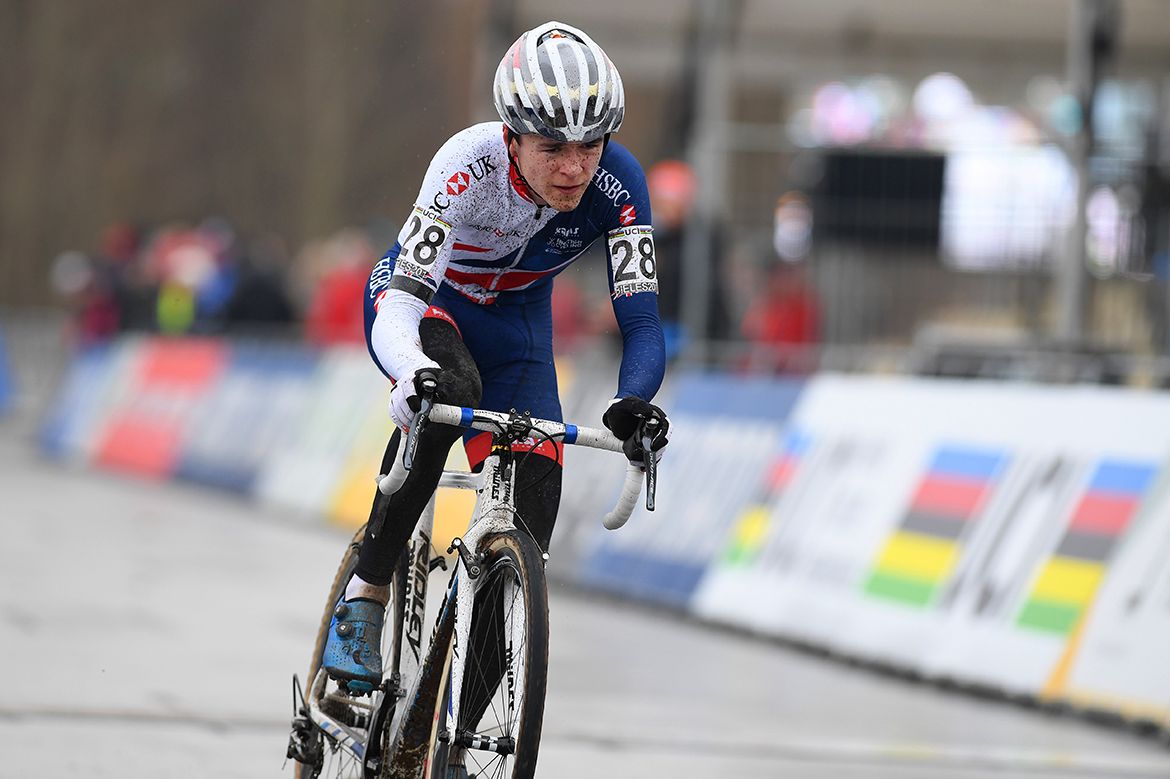 Tom Pidcock riding towards victory