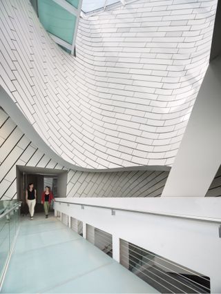 bridge under curved skylight opening at Orange County Museum of Art by Morphosis