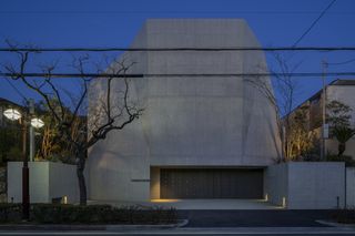 Night view of modern concrete japanese house by maniera architects