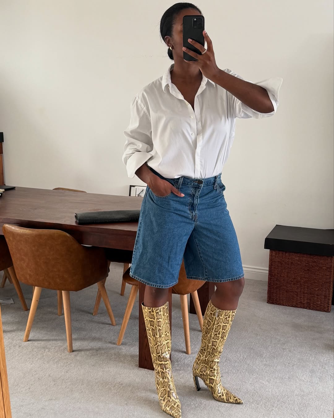 woman wearing bermuda shorts with boots outfit 2025