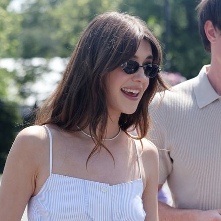 Daisy Edgar wears a matching linen set and carries a Gucci straw bag at Wimbledon