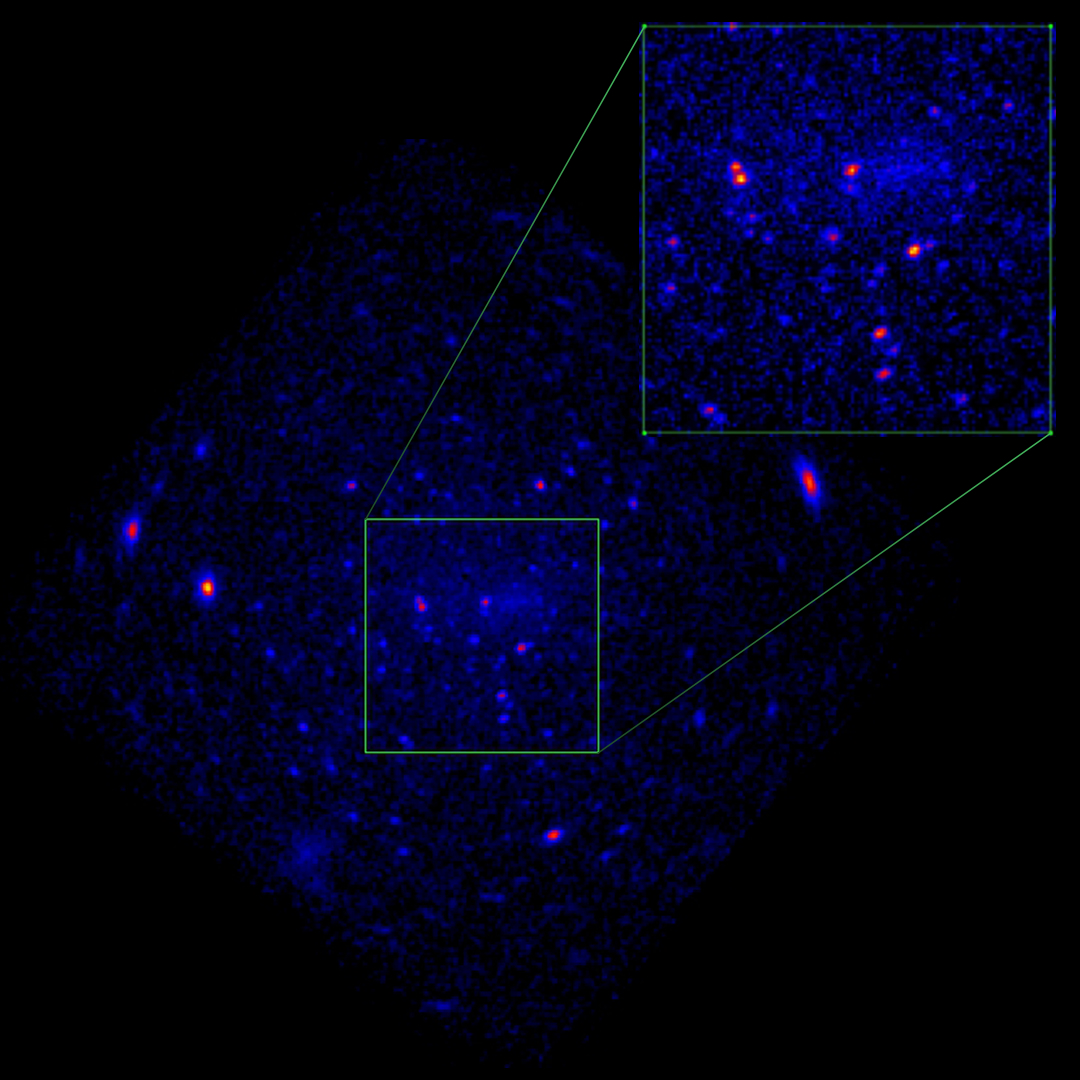 Dark image of a rectangular purple dot in space.  Two regions are marked with white boxes.