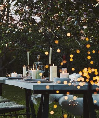 sparkle lighting fairy lights around dining scene outdoors