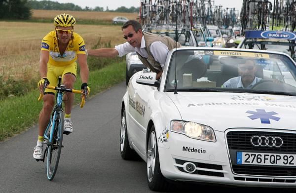 Race leader Rinaldo Nocentini visits the doctor's car after being involved in a crash during stage 11.