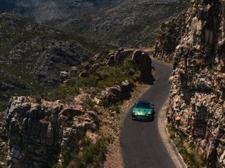 Aston Martin DB12 on mountain road