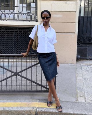 Woman wearing denim pencil skirt