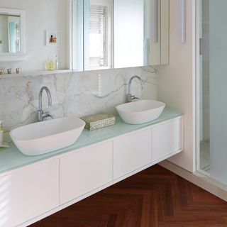 white bathroom with twin basins