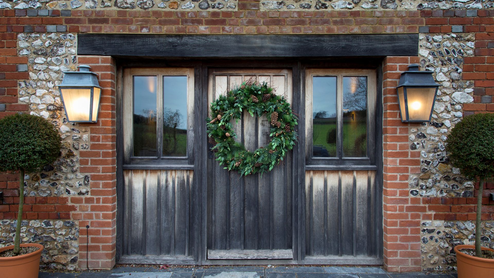 picture of large Christmas wreath on front door