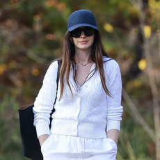 Anne Hathaway enjoys some fresh air as she goes for a solo stroll through Central Park in NYC after election day wearing adidas sambas 