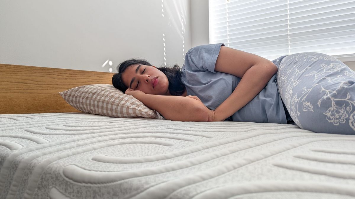 Our tester lying in the front, back and side positions to assess the comfort and support of the mattress