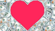 Cash is arranged to form a heart shape.