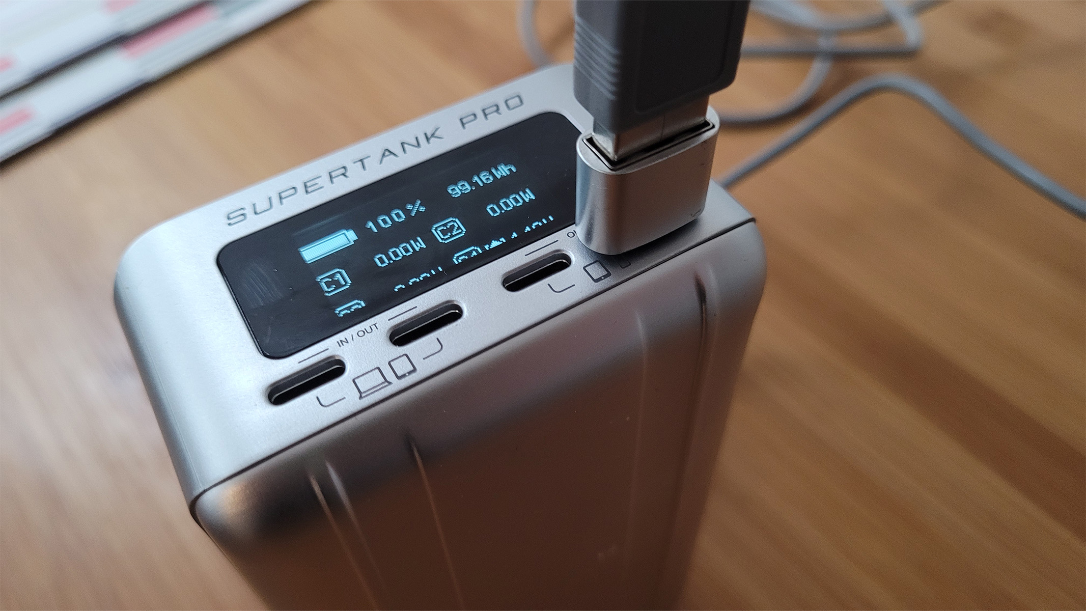 The Zendure SuperTank Pro showing the included USB-A adapter plugged into the USB-C port