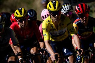 Yellow jersey of overall leader, Team SD Worx's Belgian rider Lotte Kopecky (C), rides in the pack during the fifth stage (out of 8) of the second edition of the Women's Tour de France cycling race 126,5 km between Onet-Le-Chateau and Albi, in the Tarn region, south-western France, on July 27, 2023. (Photo by JEFF PACHOUD / AFP)