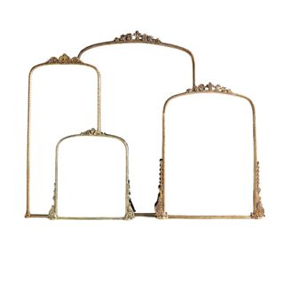 Gleaming Primrose Mirror in four sizes in gold stacked upon one another
