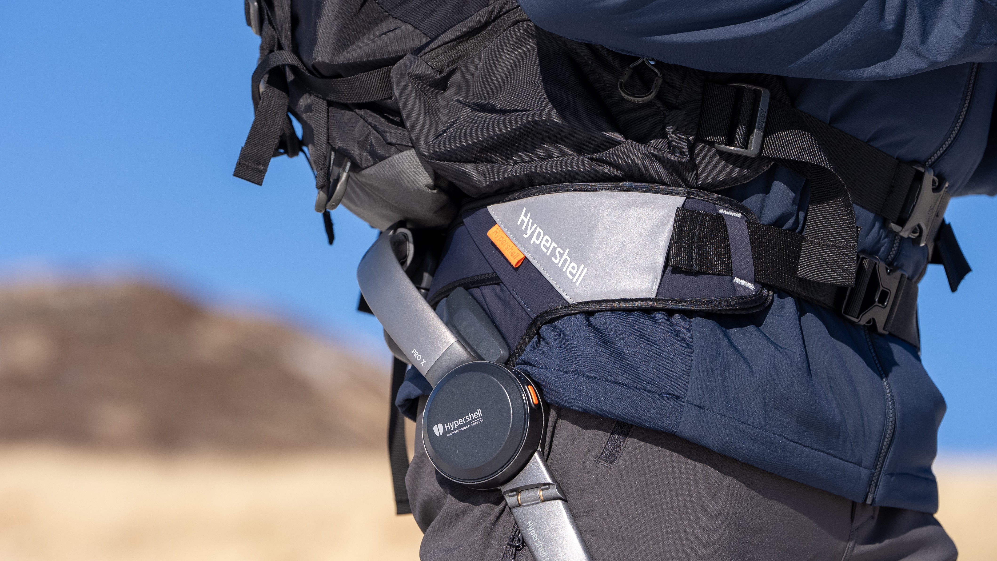 Close up of hiker wearing the Hypershell Exoskeleton