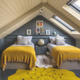 Grey and mustard yellow shared kids attic bedroom