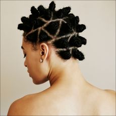 view of woman with natural hair from behind, over the shoulder