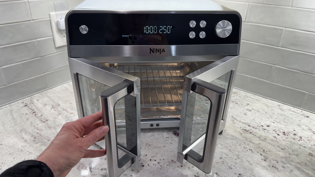 Ninja French Door Air Fryer and Countertop Oven on counter with hand opening door