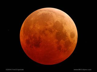 The moon turns blood-red in this image of a total lunar eclipse from 2004. A total eclipse of a "blue moon" will occur on Jan. 31, 2018.