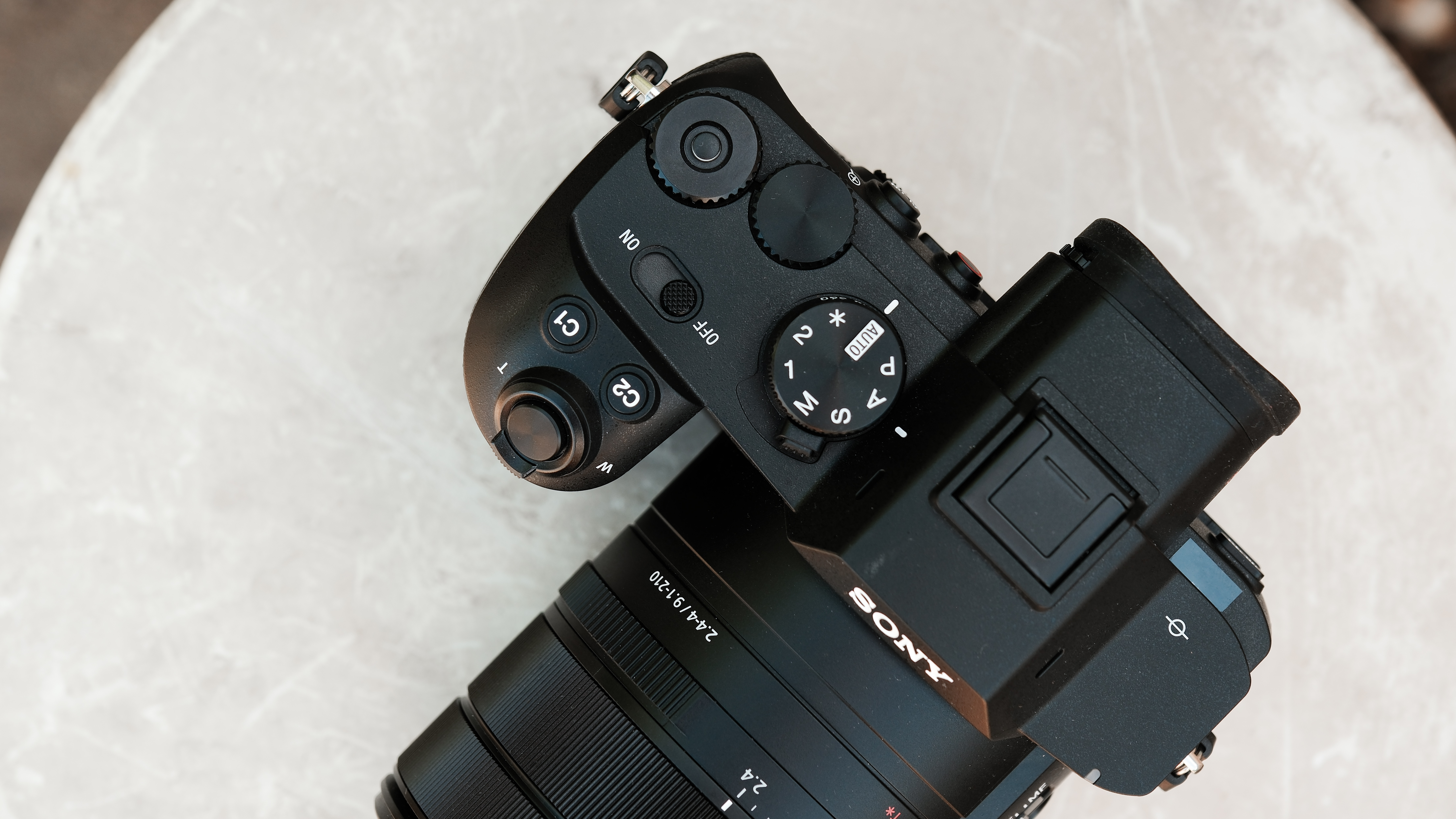 Top view of the Sony RX10 V showing its mode dial, control dials, and zoom rocker.