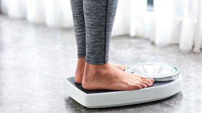 Person on weighing scales