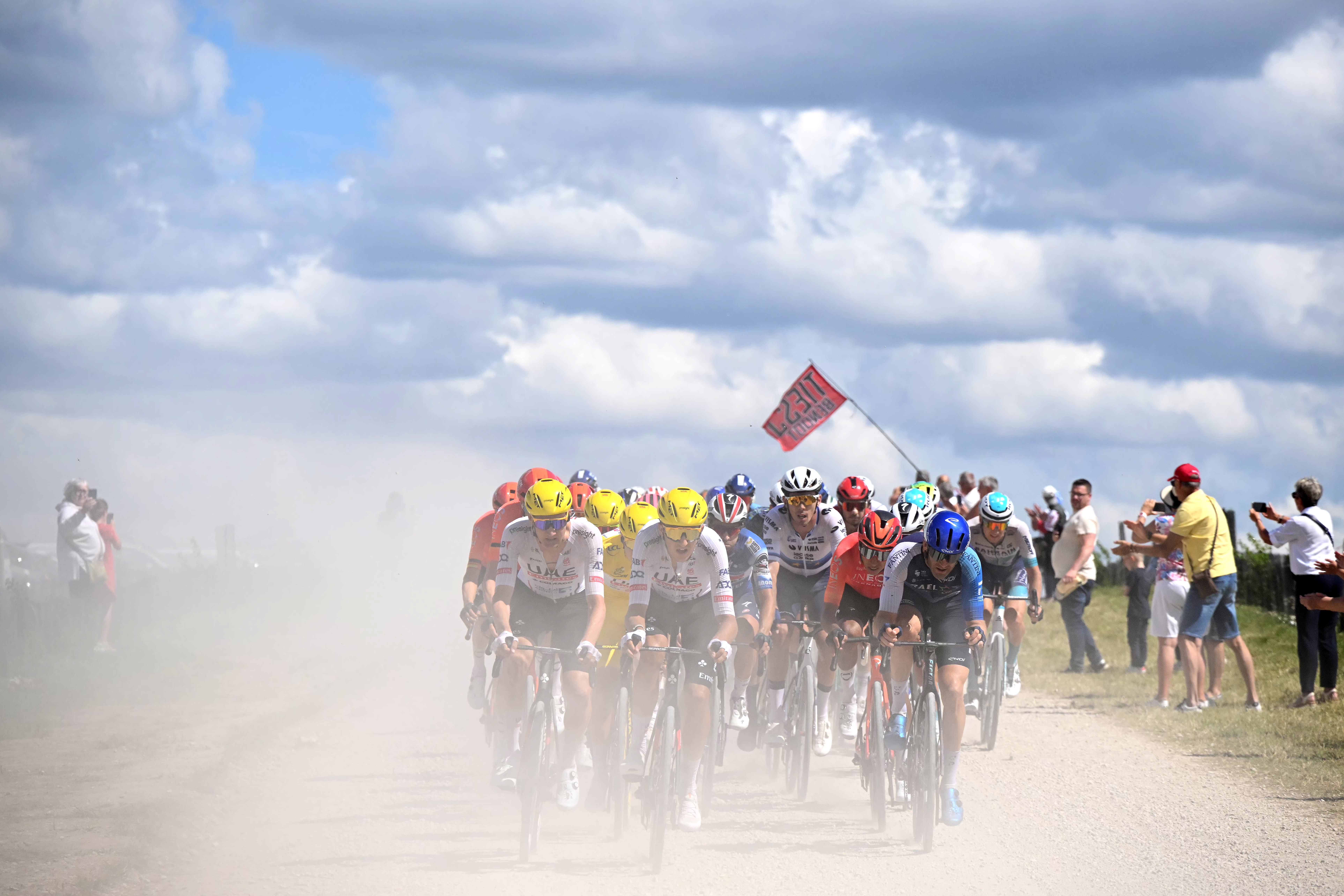 TROYES, FRANCE - JULY 07: (L-R) Tim Wellens of Belgium, Tadej Pogacar of Slovenia - Yellow Leader Jersey, Marc Soler of Spain and UAE Team Emirates, Egan Bernal of Colombia and Team INEOS Grenadiers and Hugo Houle of Canada and Team Israel - Premier Tech compete passing through a gravel strokes sector during the 111th Tour de France 2024, Stage 9 a 199km stage from Troyes to Troyes / #UCIWT / on July 07, 2024 in Troyes, France. (Photo by Bernard Papon - Pool/Getty Images)
