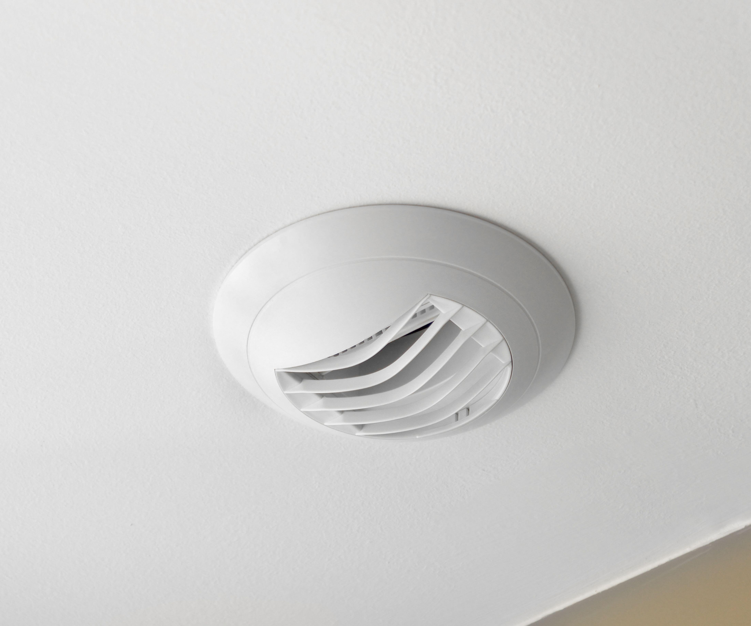 white extractor fan on white surface
