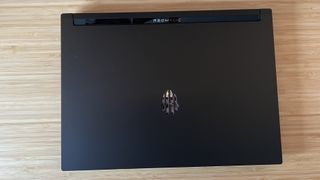 RedMagic Titan 16 Pro laptop lid on a wooden desk