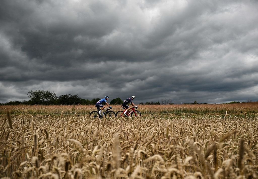 TOPSHOT IsraelPremier Tech teams Danish rider Jakob Fuglsang L and TrekSegafredo teams American rider Quinn Simons R cycle in a breakaway during the 6th stage of the 109th edition of the Tour de France cycling race 2199 km between Binche in Belgium and Longwy in northern France on July 7 2022 Photo by Marco BERTORELLO AFP Photo by MARCO BERTORELLOAFP via Getty Images