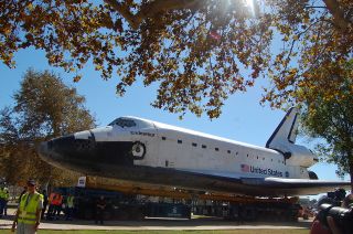 Space shuttle Endeavour rolls toward its new display pavilion at the California Science Center in Los Angeles in the final stretch of its three-day, 12-mile (19 km) "Mission 26" journey.